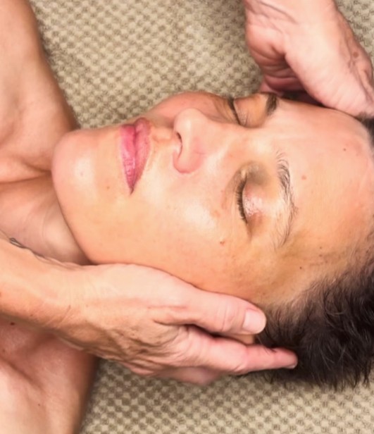 A somatic facial massage in progress